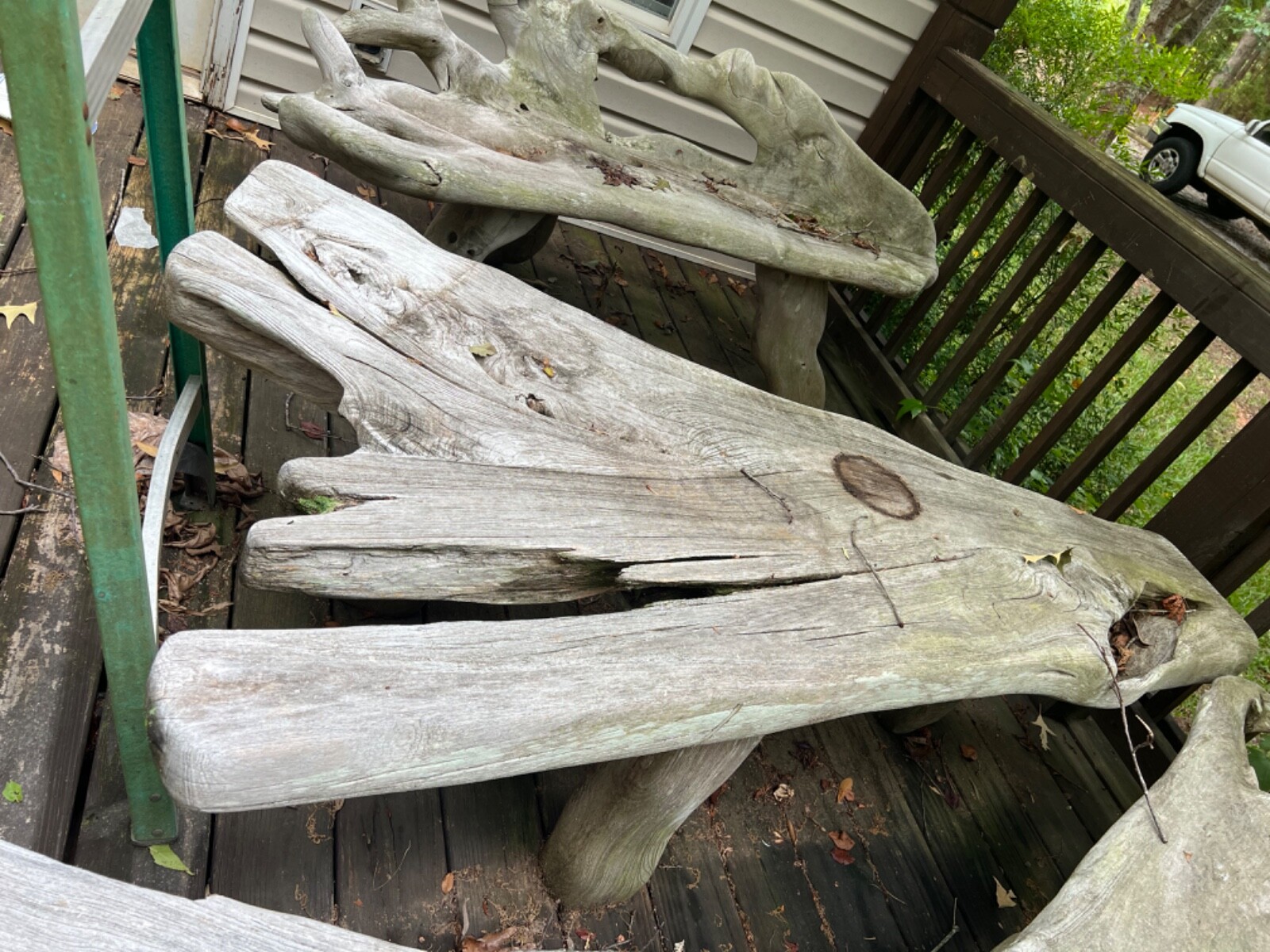 Two Driftwood Benches and one table with side piece. Very heavy.