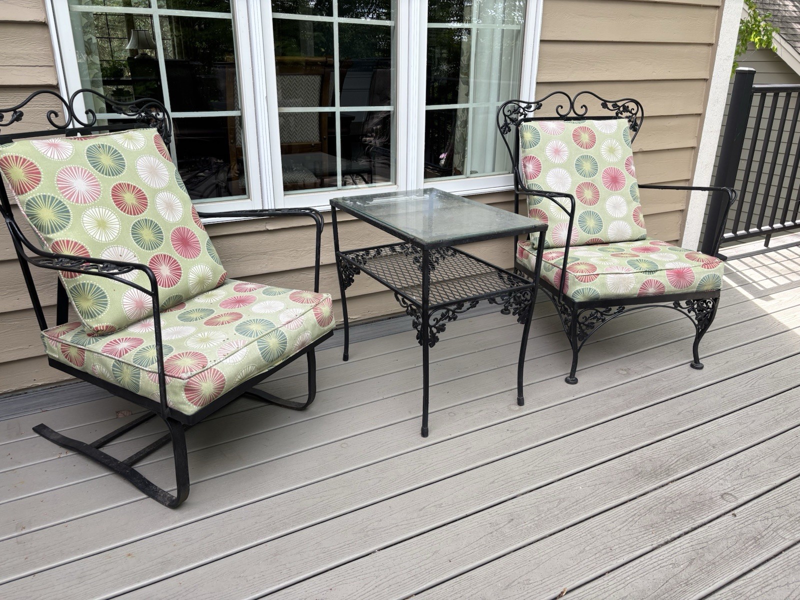 1960s two wrought iron chairs and two matching glass top tables.