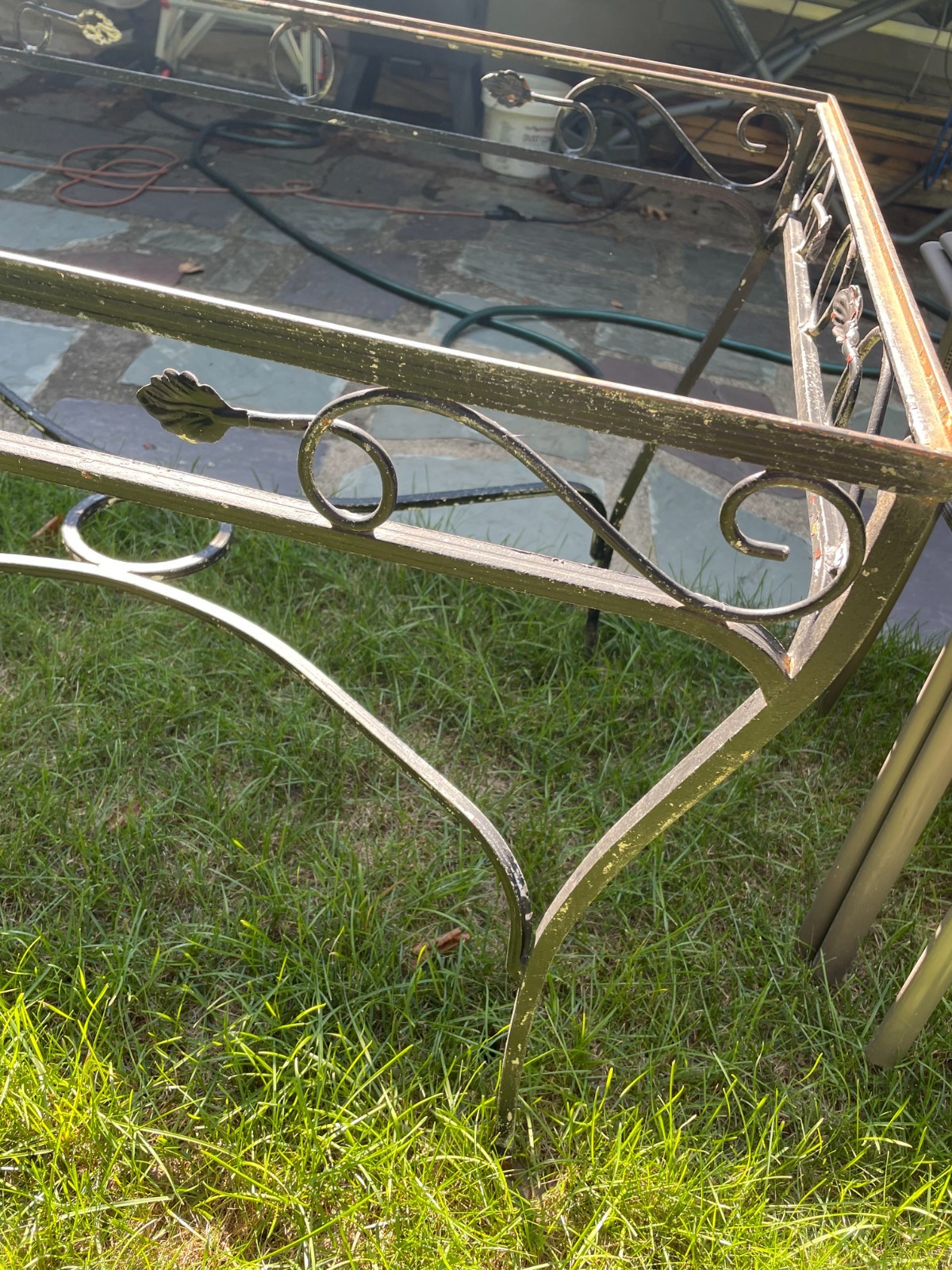 vintage wrought iron table and 3 chairs. chair seats included
