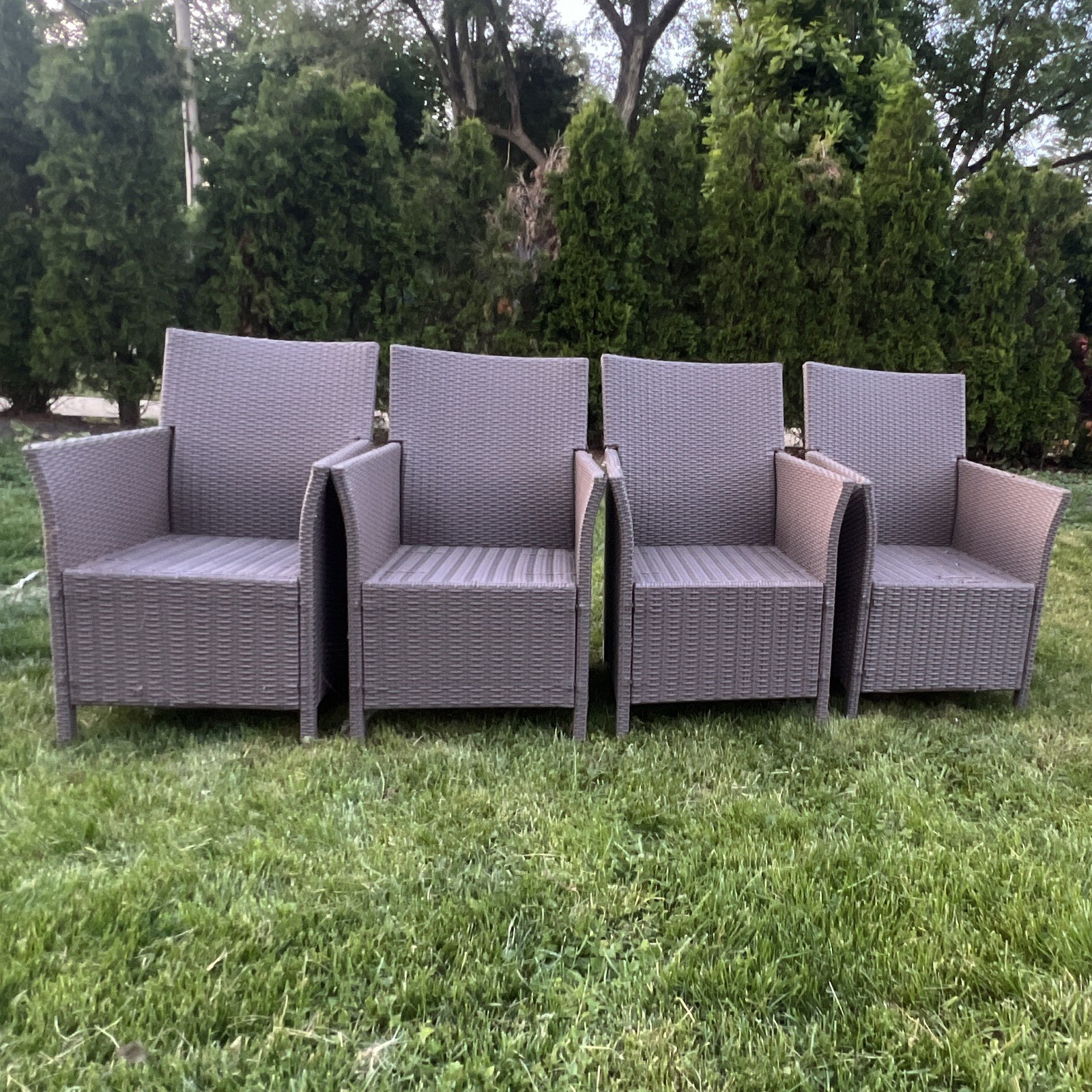 Stylish wicker/rattan-look patio chairs in good used condition, 4 piece